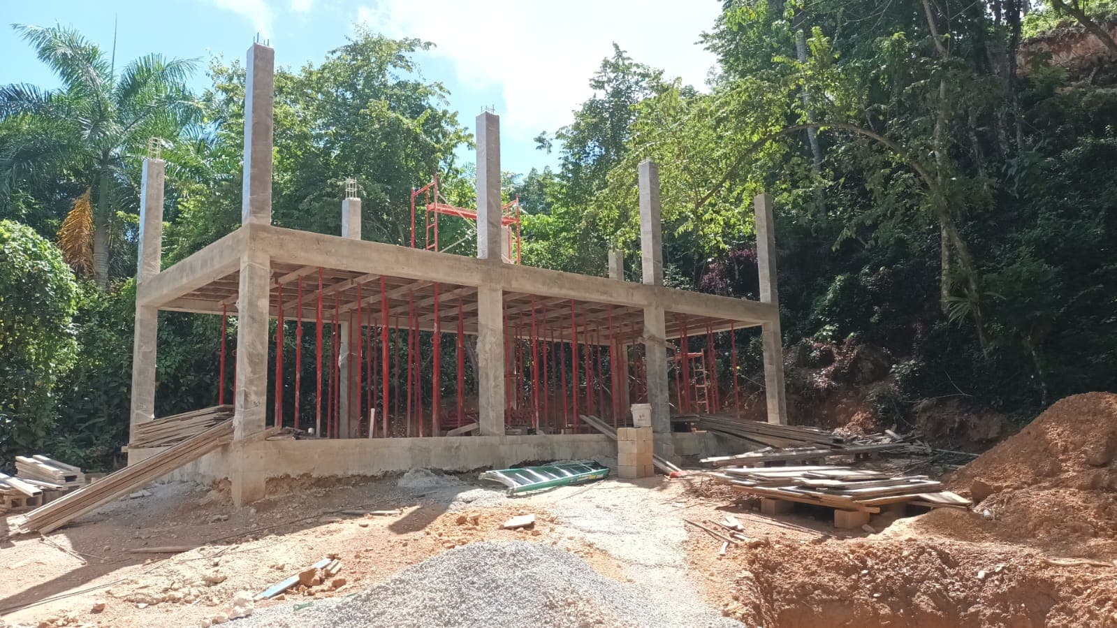 The two-storey concrete shell of a Samanea loft with the steel pergola frame in place